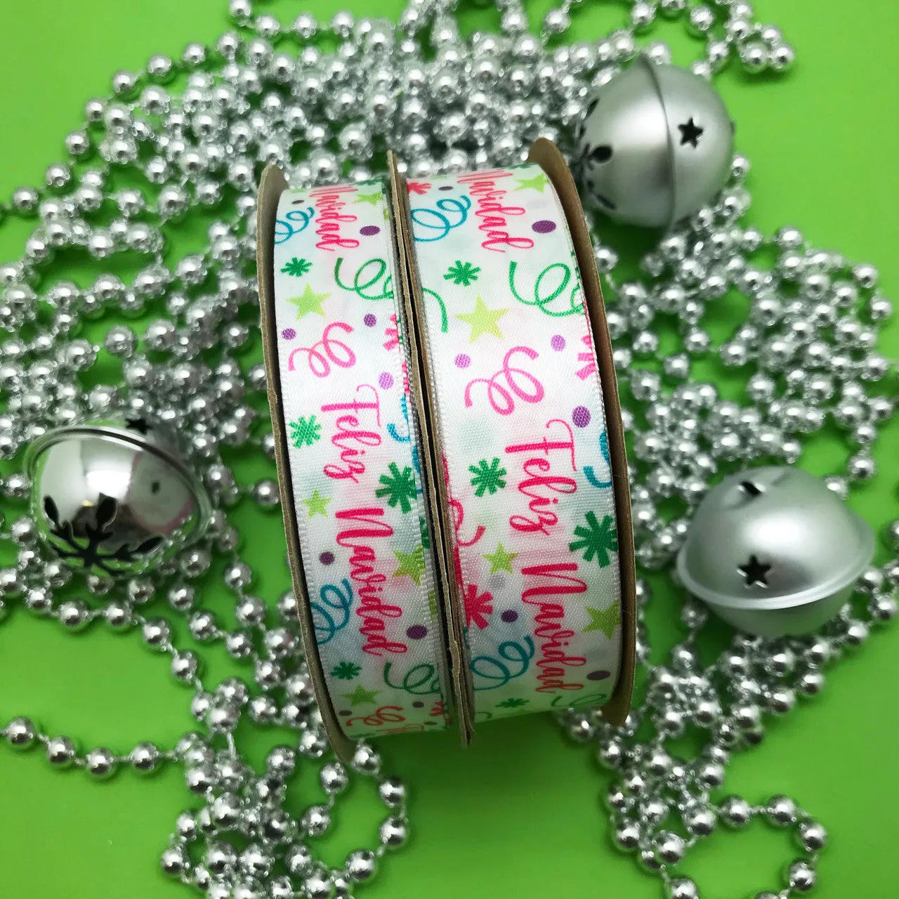 Feliz Navidad Ribbon with confetti and streamers in pink, green, blue and purple printed on 7/8" white single face satin 10 yrds